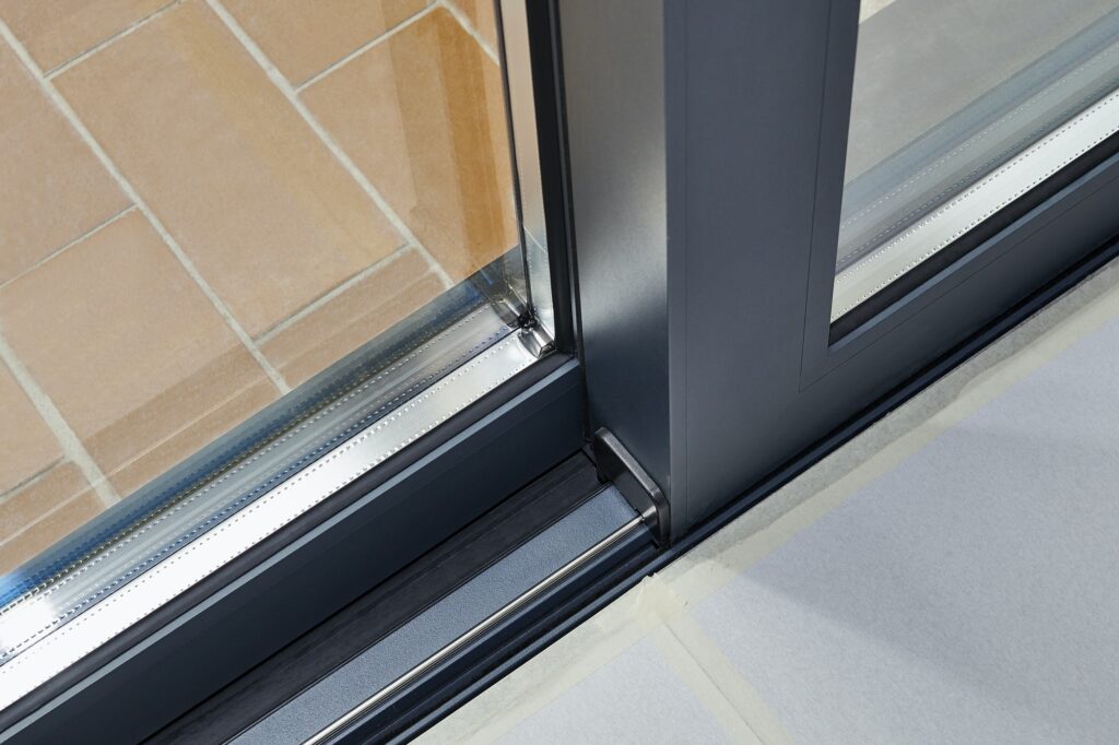 reduce friction along the door's travel path Sliding glass door detail and rail