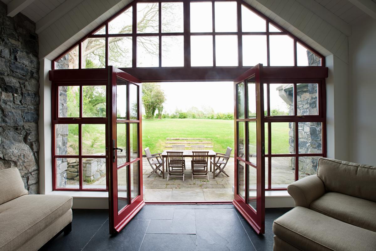 Room with doors open onto patio